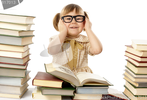 Image of Happy little girl with books wearing black glasses