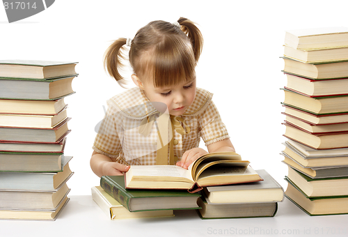 Image of Cute little girl reading books, back to school