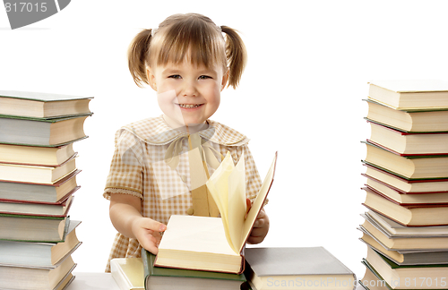 Image of Happy little girl with books, back to school