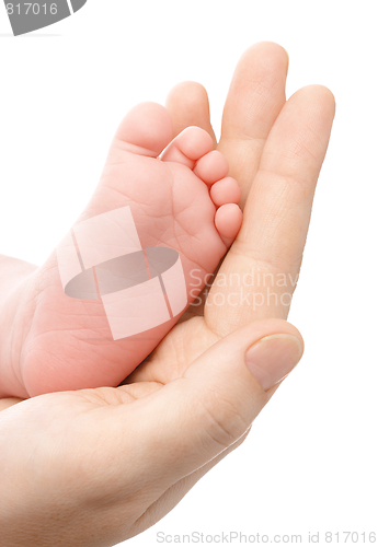 Image of Mother holding her newborn's foot