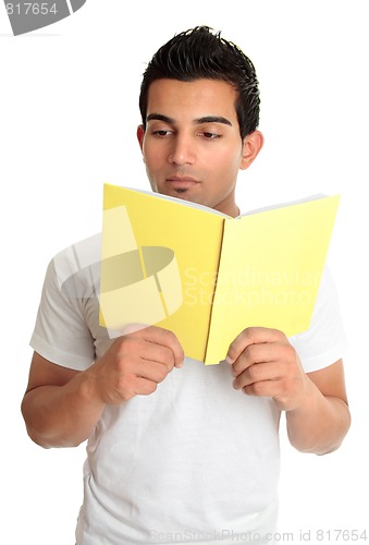 Image of Man reading from a book