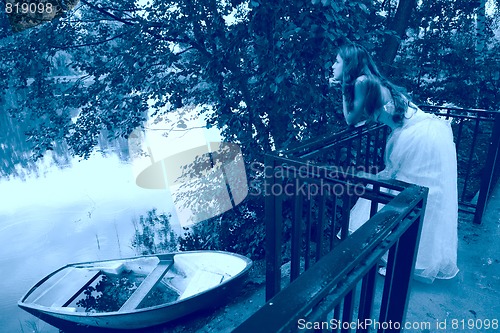 Image of pensive girl and boat