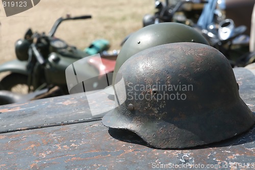 Image of two military soldier metallic helmets