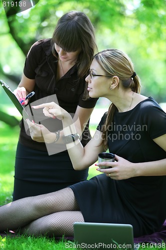 Image of businesswoman gives instructions to secretary