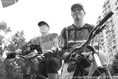 Image of two serious bicyclists