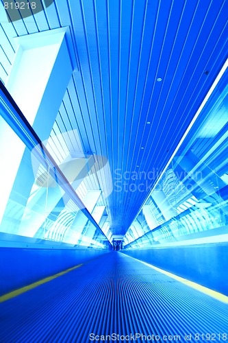 Image of blue moving escalator