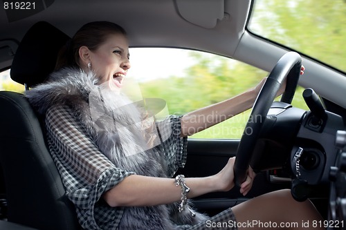 Image of woman yells in car