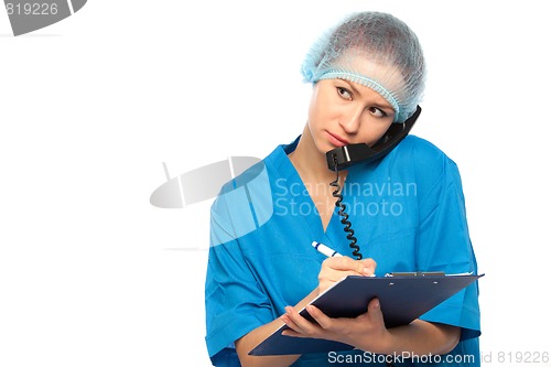 Image of physician does record in pad
