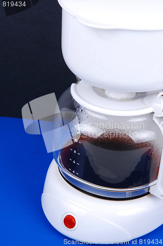 Image of Closeup of white coffee maker.