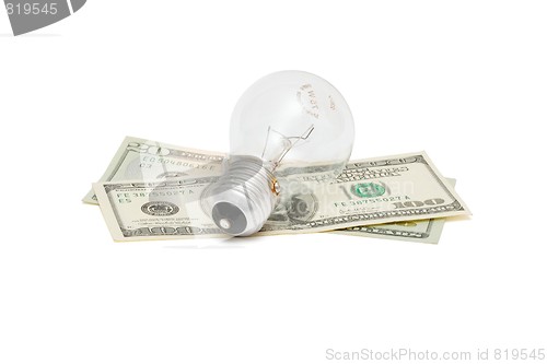 Image of Electric bulb on dollar bills isolated