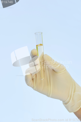 Image of Hand holding test tube - isolated