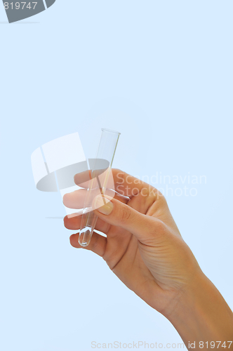 Image of Hand holding test tube - isolated