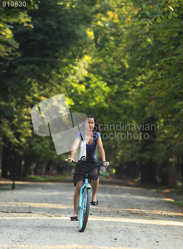 Image of Woman riding a bicycle