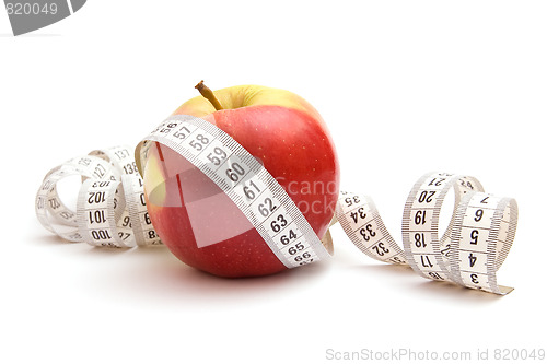 Image of Red apple and measuring tape