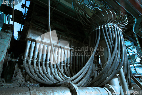 Image of Pipes, tubes, machinery and steam turbine at a power plant
