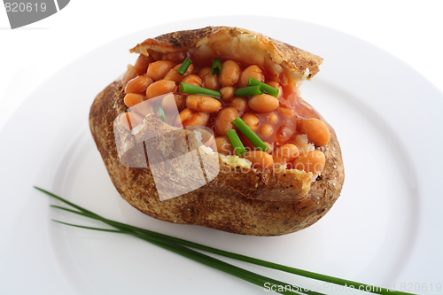 Image of Russet baked potato with beans and chives