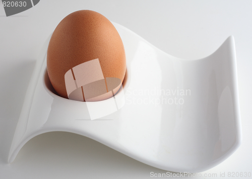 Image of Brown egg in modernist eggcup