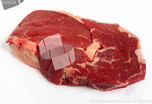 Image of Raw ribeye steak on a white background