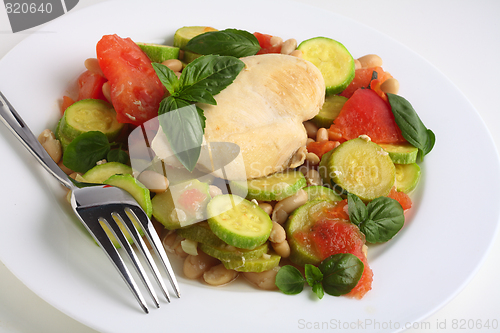 Image of Italian chicken and vegetables with a fork
