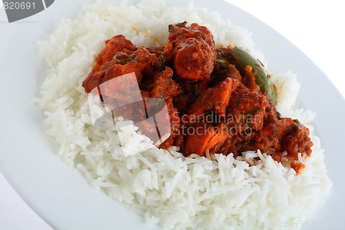 Image of Chicken tikka masala over a white background