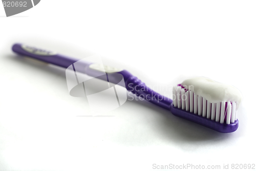 Image of Toothbrush and toothpaste with shadow