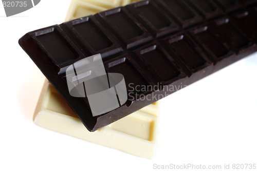Image of Dark and white cooking chocolate over white