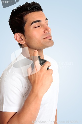 Image of Male spraying perfume cologne