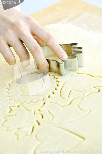 Image of Cookie cutter and dough
