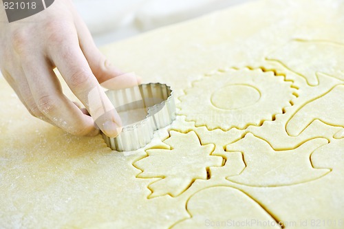 Image of Cutting out cookies from dough