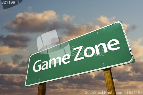Image of Game Zone Green Road Sign and Clouds