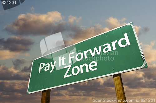 Image of Pay It Forward Zone Green Road Sign and Clouds