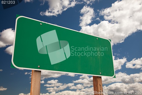 Image of Blank Green Road Sign Over Clouds