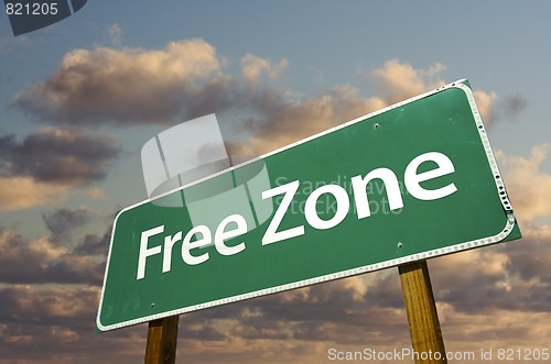 Image of Free Zone Green Road Sign and Clouds