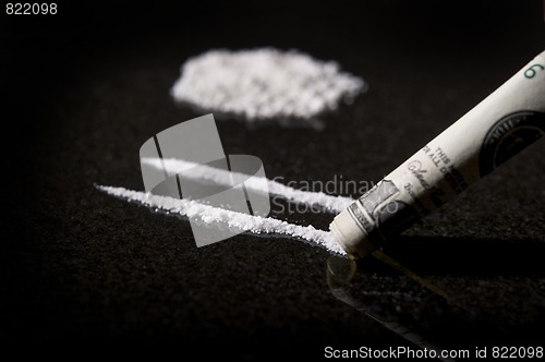 Image of Lines of Cocaine with rolled bill