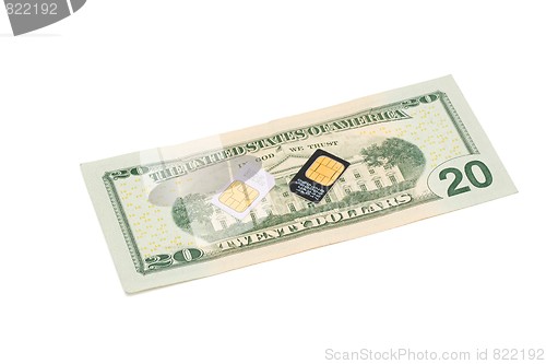 Image of Two SIM cards for cellular phones on dollar bill isolated 