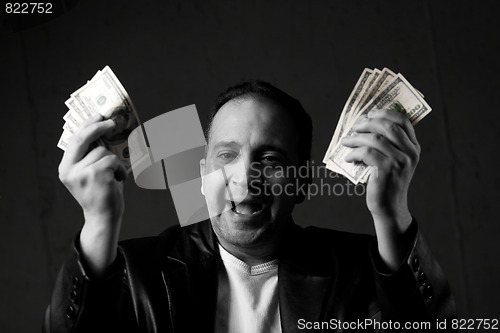 Image of Man Celebrating with Cash
