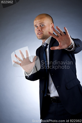 Image of scared  handsome businessman