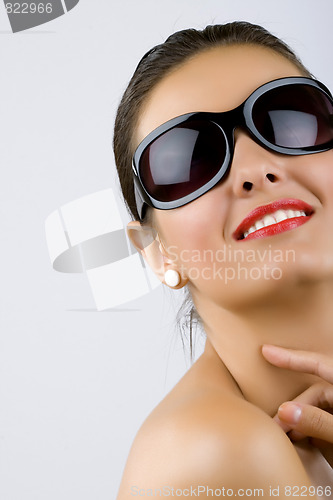Image of brunette with sunglasses