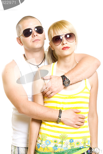 Image of young trendy couple wearing sunglasses