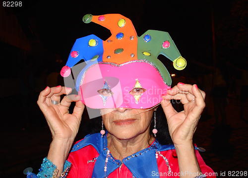 Image of elderly masked clown fantasy in carnival