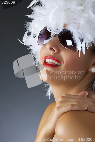 Image of woman with white feather wig
