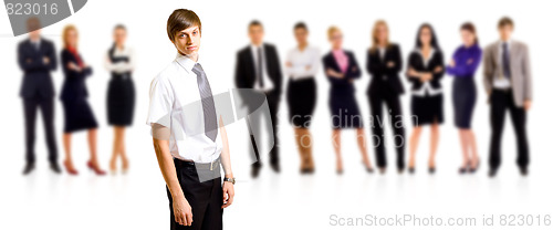 Image of business man smiling leading a team