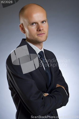 Image of businessman smiling at camera