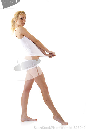 Image of woman pulling her undershirt