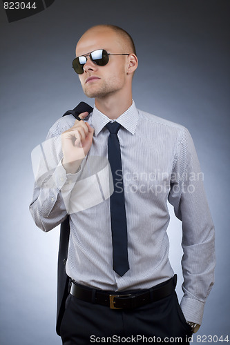 Image of young businessman looking away