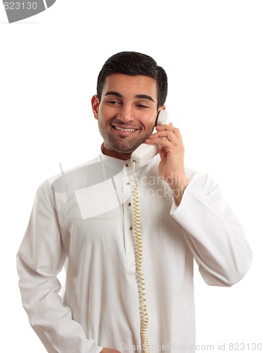 Image of Middle eastern arab man using the telephone