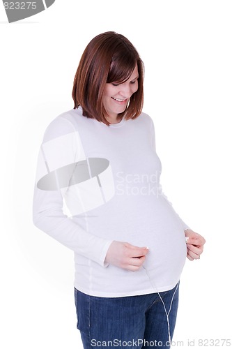 Image of Mother With Headphones on Belly