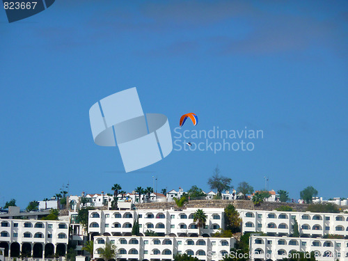 Image of Parachutist Over Apartments