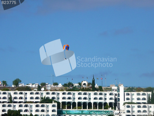 Image of Parachutist Over Apartments