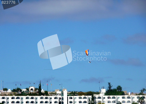 Image of Parachutist Over Apartments